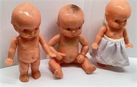 Lot of three vintage Irwin Kewpee-like dolls.