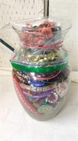 Jar full of miscellaneous jewelry