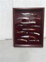 12 Collectible knives in  a case and magnetic to