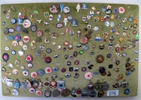 Panel of vintage pins and badges