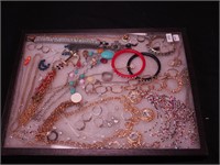 Container of costume jewelry: Charming Charlie,