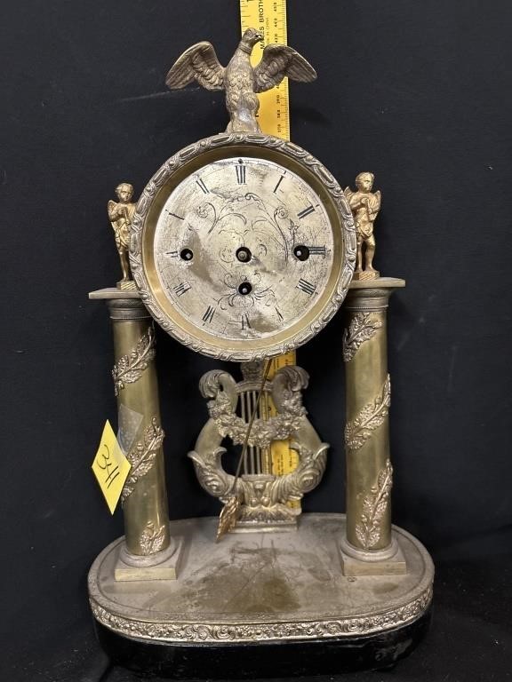 vinatge clock with key and pendulum