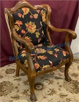 Antique upholstered clawfoot chair