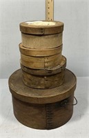 Stack of 4 wooden round cheese boxes in graduated