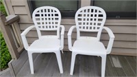 2 Grosfillex stacking armchairs.
