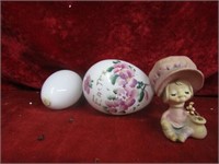 Blown glass easter eggs and figurine.