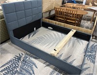 Blue queen upholstered bedframe with roll stats