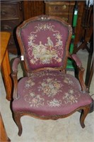 Carved mahogany parlor chair with courting couple