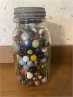 Jar of marbles with galvanize lid