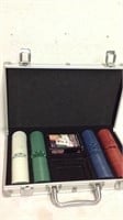 Clay poker chips in storage case with cards