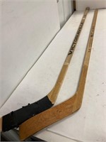 2 left handed hockey sticks.