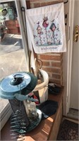 Bird feeder, bucket of whisk brooms, garden flag