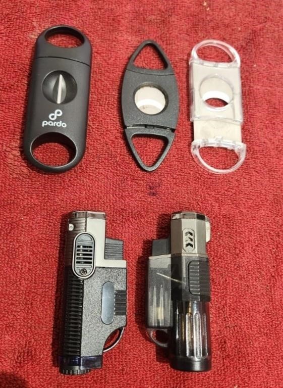 3 Cigar Cutters, 2 Torch Lighters. 1 Single, 2