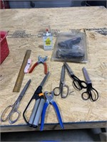 Glue gun, sewing machine oil, scissors, measuring