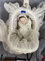 Old China Doll in Bassinet
