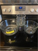 2 glass mixing bowls and 1 glass container