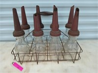 8 ct antique oil bottles in metal crate