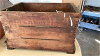 Wood crate with telephone  wire inside.