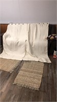 Set of of curtains, throw rugs, and pillow