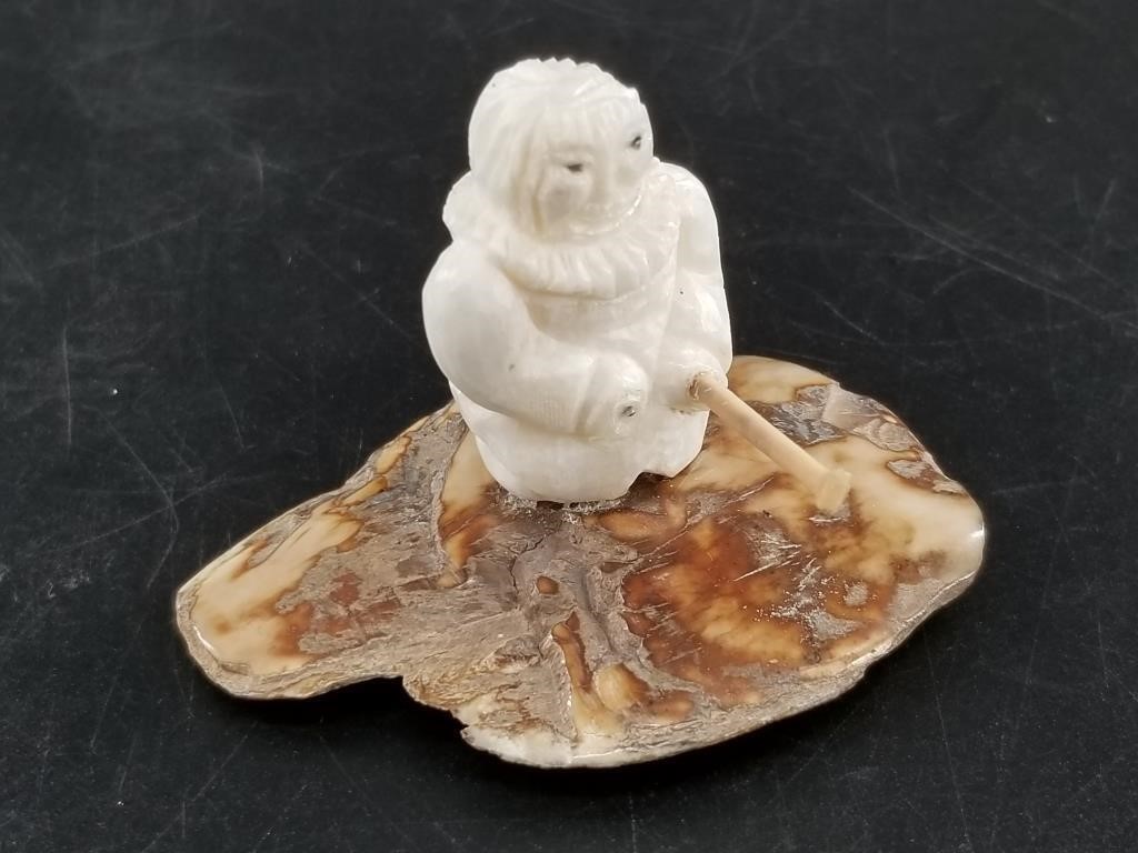 Small ivory carving of an ice fisher. With broken