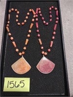 Vintage carved coral colored beaded necklaces