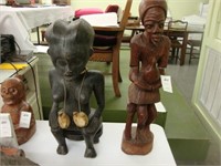 Two carved primitive wooden figures.