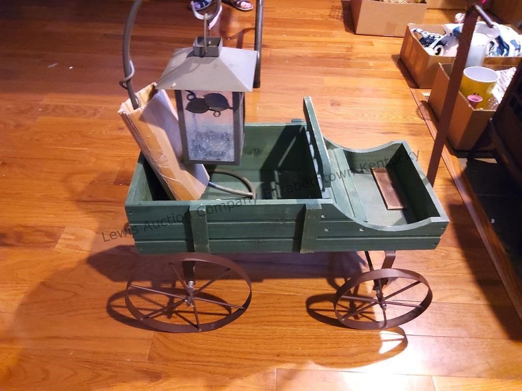 Small green wooden wagon with a battery operated