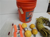 bucket with fishing buyos, and rope