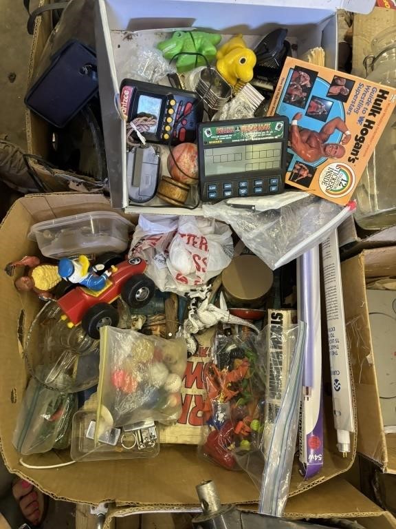 box lot of handheld electronic games, fm radio