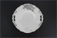 One White Porcelain Plate With Silver Edge
