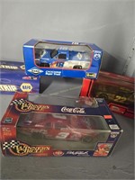 4 Nascar collectors cars and truck as shown