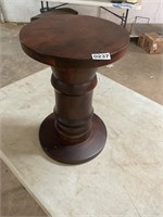 Round wooden pedestal table