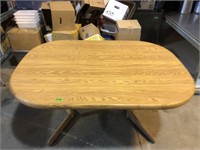 42 in x 60 in Dining table with leaf. (Measured