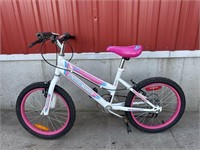 Pink and white childs bike