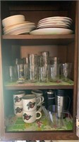 Kitchen cabinet contents: mugs, juice glasses,