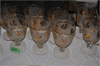 12 goblets.  gold leaf and ring motif