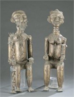 2 Seated metal figures. 20th century.