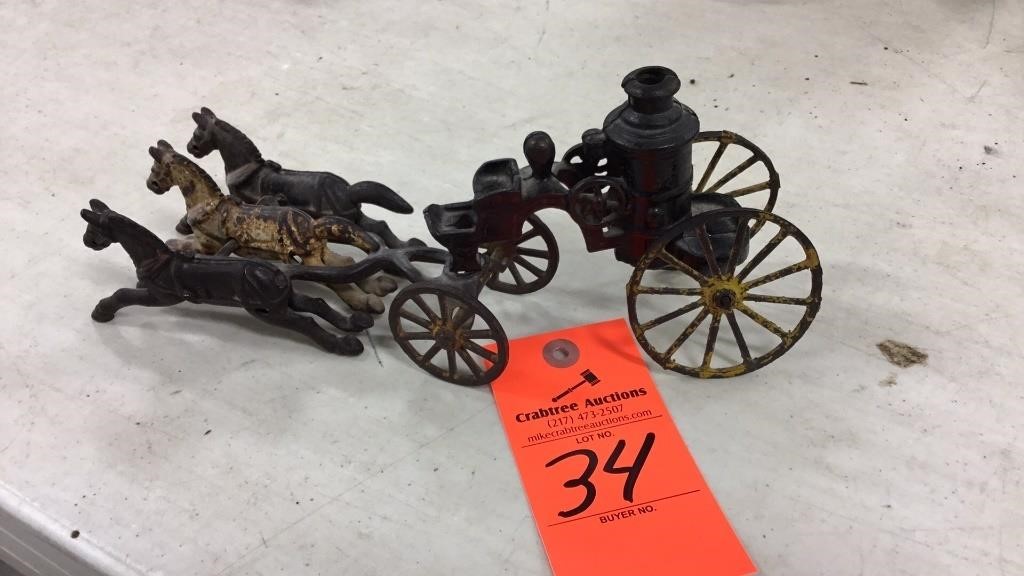 Old cast iron engine cart and horses