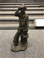Plaster cowboy figurine