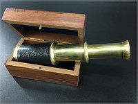 Brass spy glass in a mahogany box, spyglass is 6"