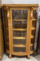 (Q) Display cabinet with curved class. Stands