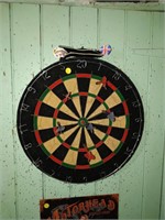 dartboard with darts