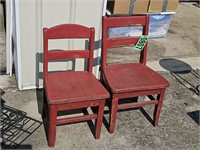 Two red painted child's chairs