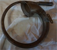 part of an old horn; brass?