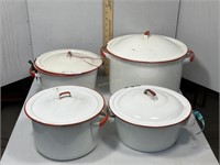 Set of 4 red & white enamel lidded cook pots