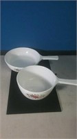 Two small CorningWare pans a skillet and a