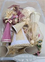 Raffia straw angels in one tote.  Various styles