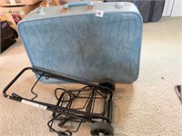 BLUE SUITCASE AND LUGGAGE CART