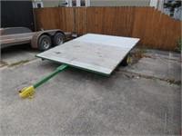 9'8" John Deere color flat bed trailer.