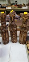 3 carved wood statues